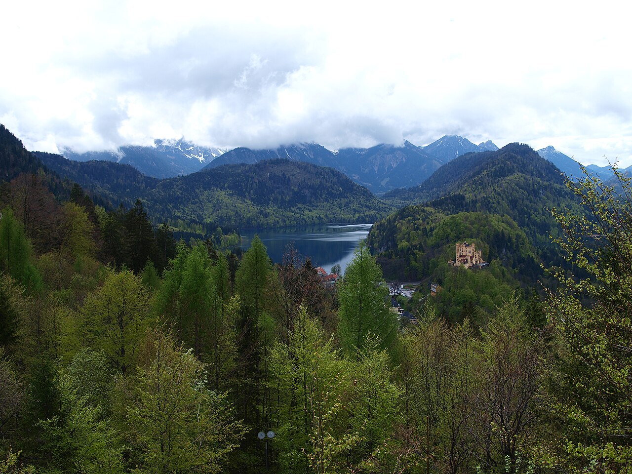 Hohenschwangau village and castle by the Alpsee lake